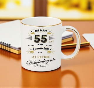 KUBEK PREMIUM NA 55 URODZINY BIAŁO-ZŁOTY ŚMIESZNY PREZENT